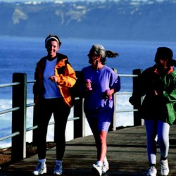 3 Women Exercise Walking Along Pier.jpg
